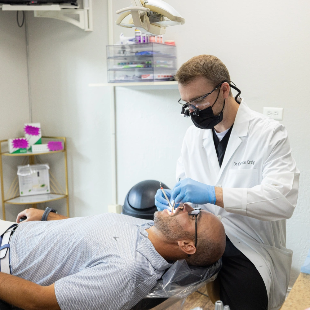 Portrait of Family Looking into the Camera and Smiling Playfully after Visiting One Eleven Dental Care